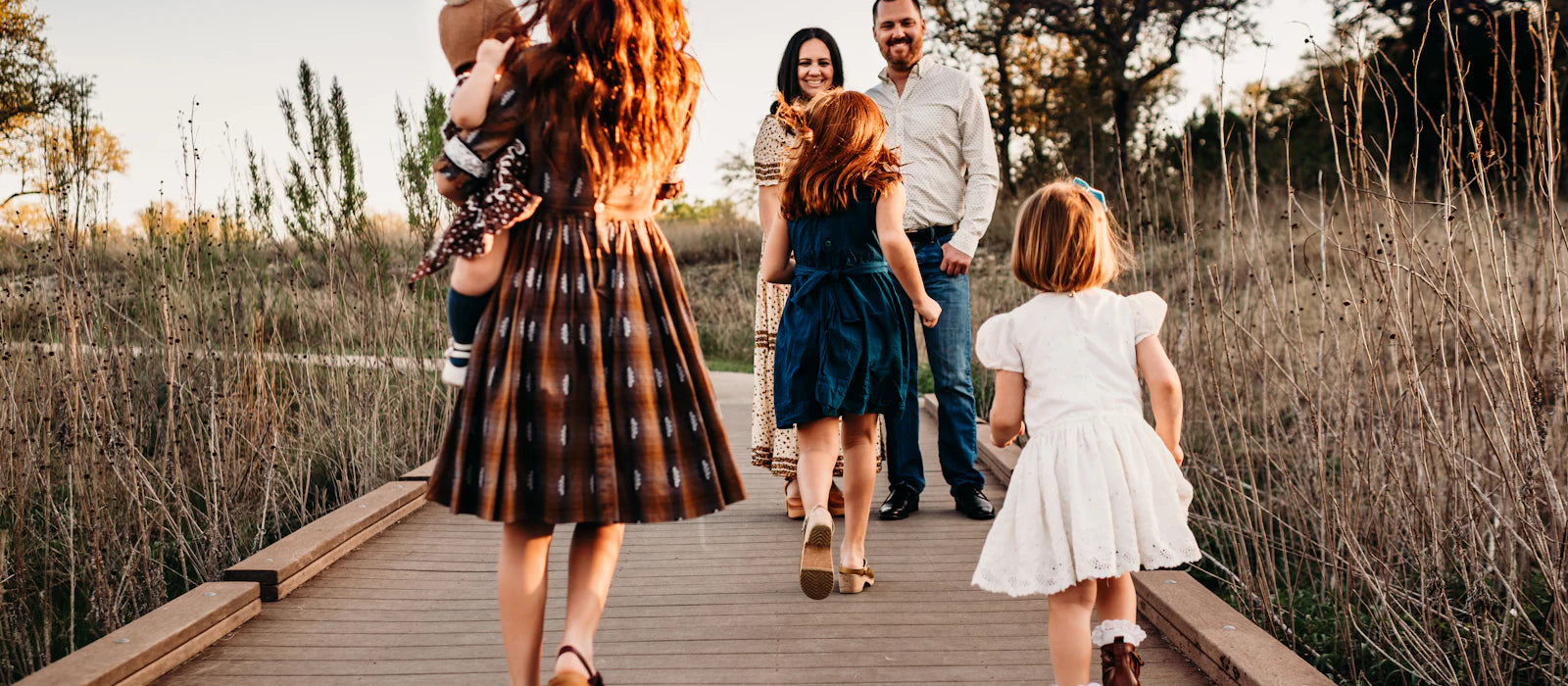 All three together — the beautiful chaos of raising them